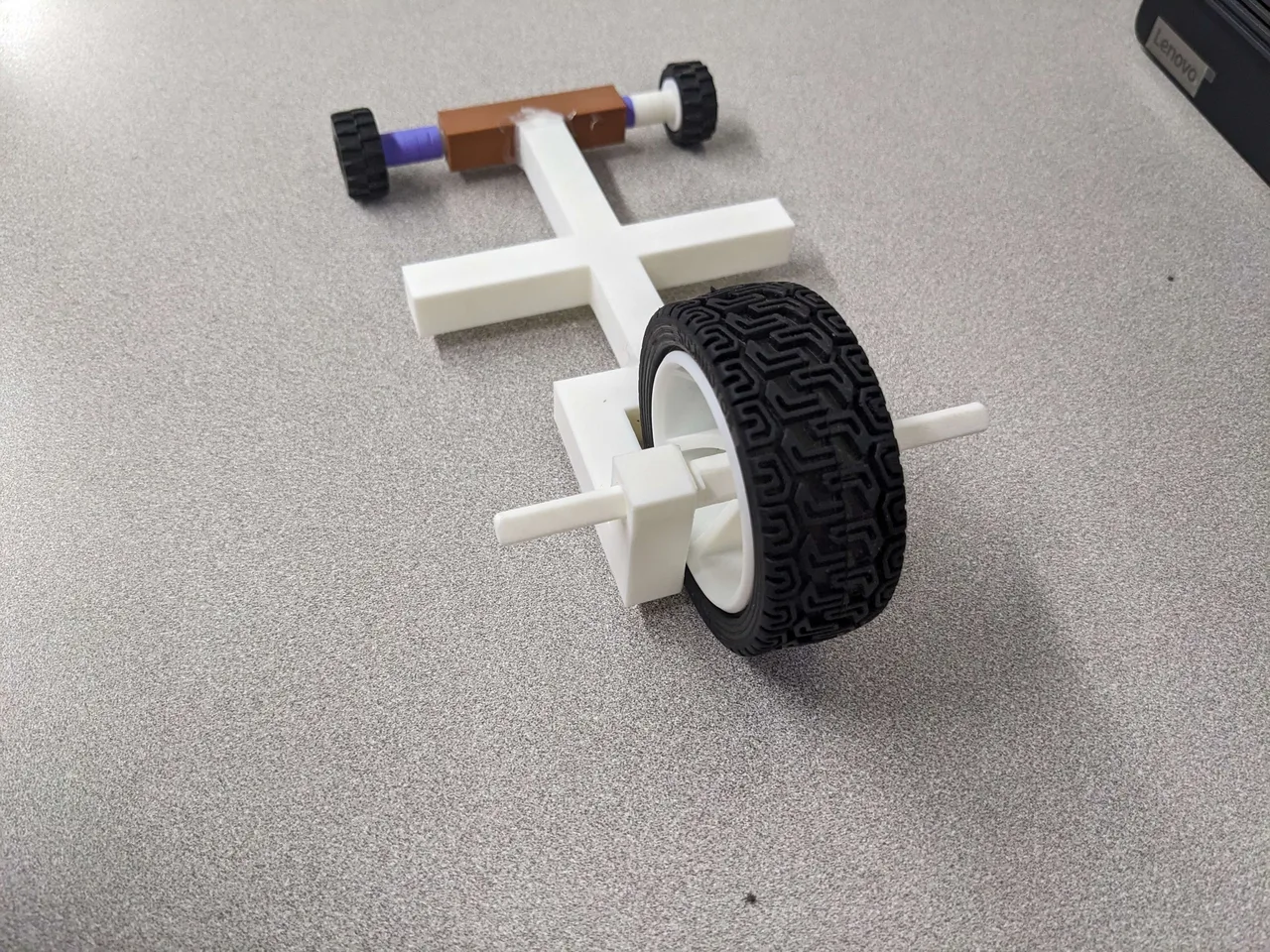 Rear angle showing the large wheel and printed vehicle frame