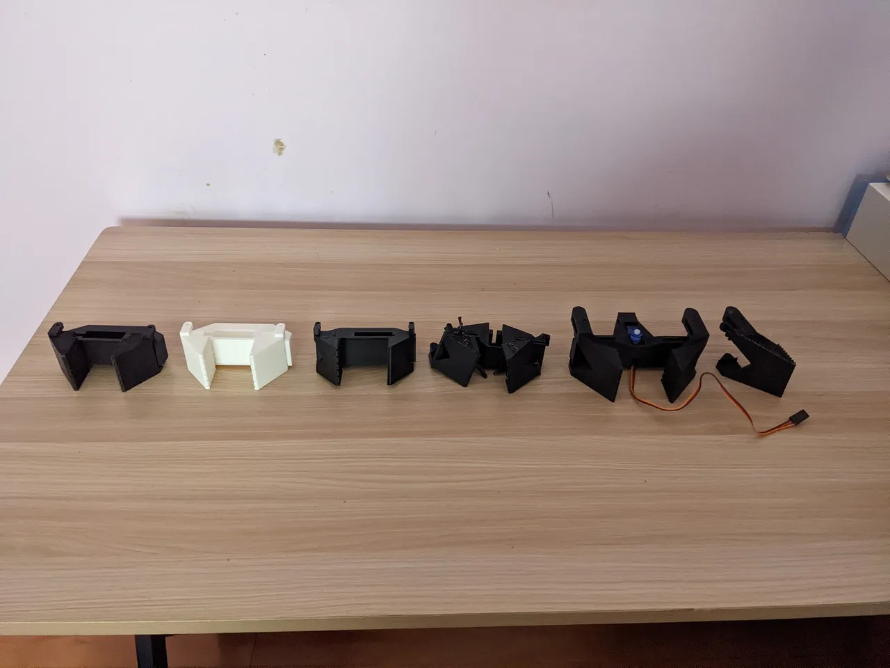 An alternate angle of the six printed gripper revisions