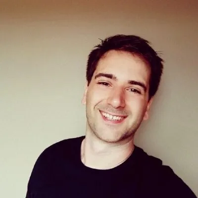 Tibo smiling in a black shirt