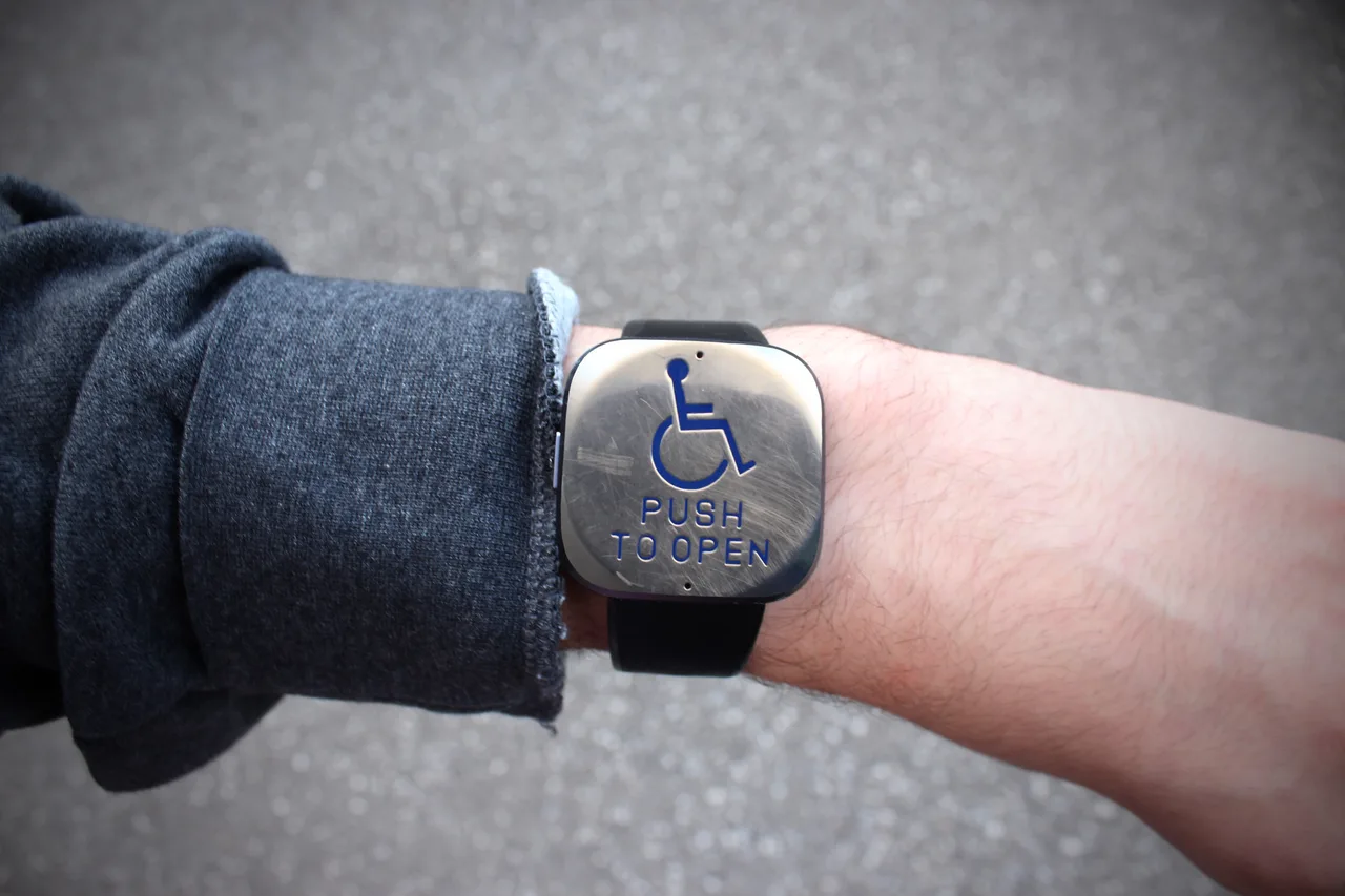 Photo composite replacing a wristwatch face with a push-to-open accessibility button